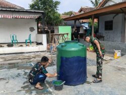 Pengecatan Toren Air Bersih, Satgas TMMD ke-129 Pastikan Sarana Bermanfaat bagi Warga